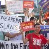 "WE ARE NOT SLAVES(우리는 노예가 아니다)"-9월 23일 오후 서울역 앞에서 열린 ‘전국 이주노동자 투쟁의 날’ 집회에서 참가자들이 고용허가제 폐지를 요구하고 있다.